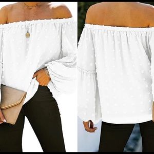 White off the shoulder blouse .